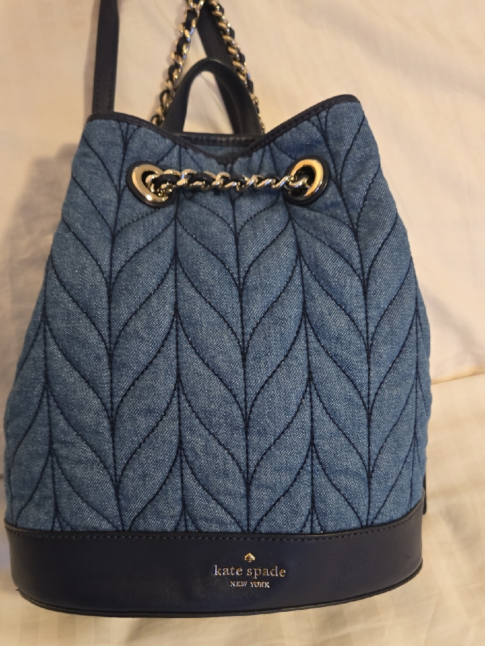 kate spade Quilted Blue Denim Drawstring Backpack with Gold Chain